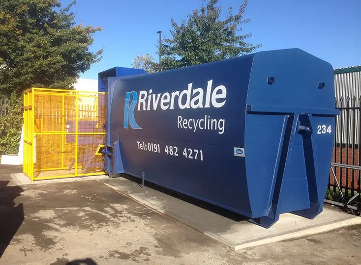 A Riverdale Recycling branded compactor container.