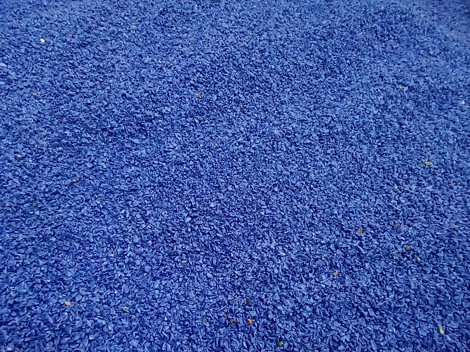 A pile of blue plastic flakes.