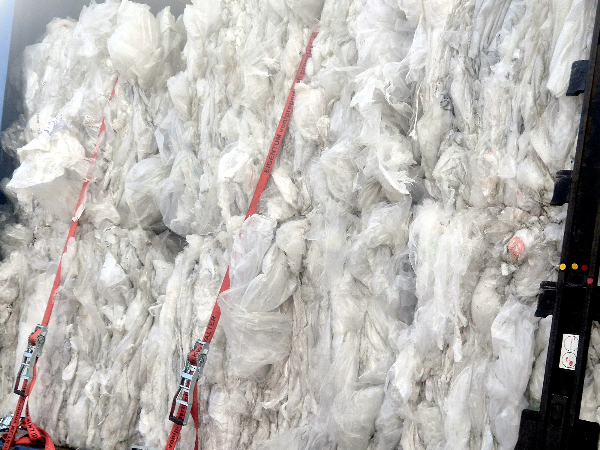 Plastic for recycling on a lorry trailer.
