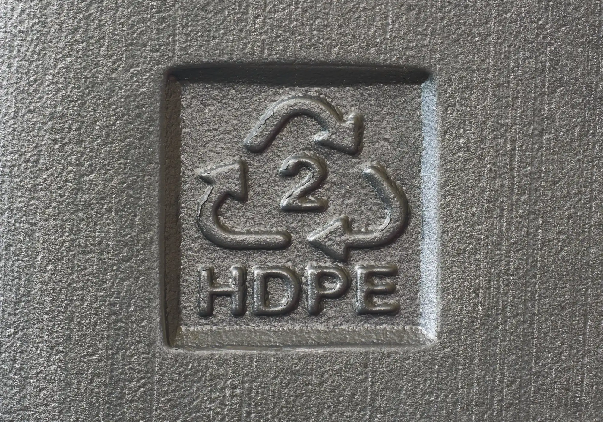 A recycling logo with a 2 in the middle and the letters HDPE under it.