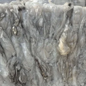 Compressed and baled translucent polythene packaging.