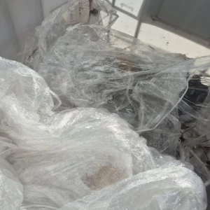 Used polythene packaging in bin.